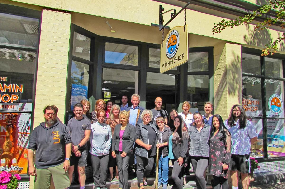 The Vitamin Shop staff outside the shop on Broad Street in Victoria, BC